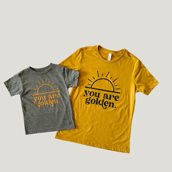 Matching gray and mustard yellow 'You Are Golden' t-shirts for mother and child